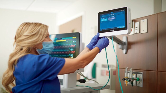Female clinician connecting monitors