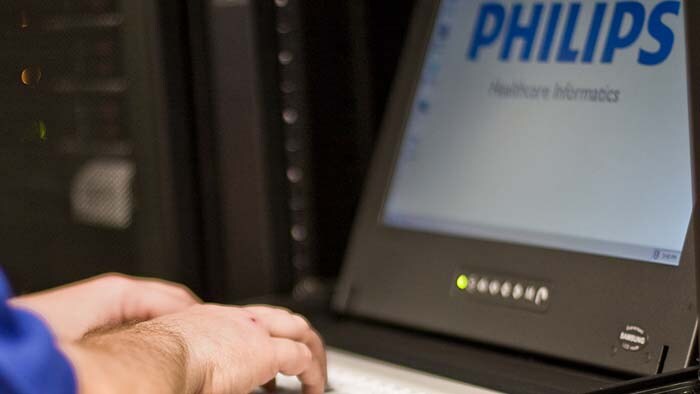 Close up of a Philips screen with a clinician typing