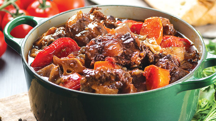 Pot roast oxtail in red wine with tomatoes