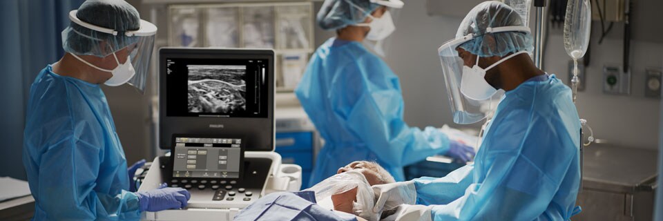 Doctors operating on a patient with scan