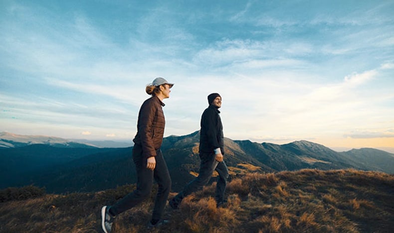 Couple walking in the mountains