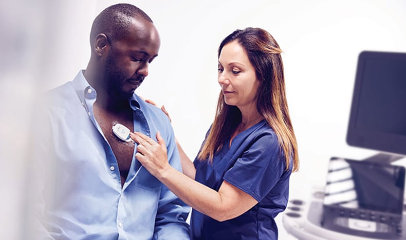 Download image (.jpg) (opens in a new window) Two doctors reviewing mammogram case