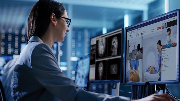 An imaging technologist providing remote support to a colleague