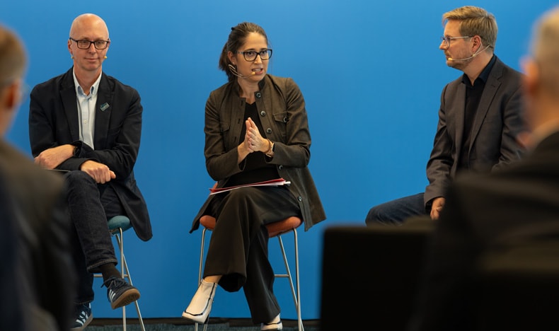 Joana Lamego, Head of Strategic Research Development at the Champalimaud Foundation, sits in a chair on a stage and presents how the Foundation is driving sustainable healthcare in action.