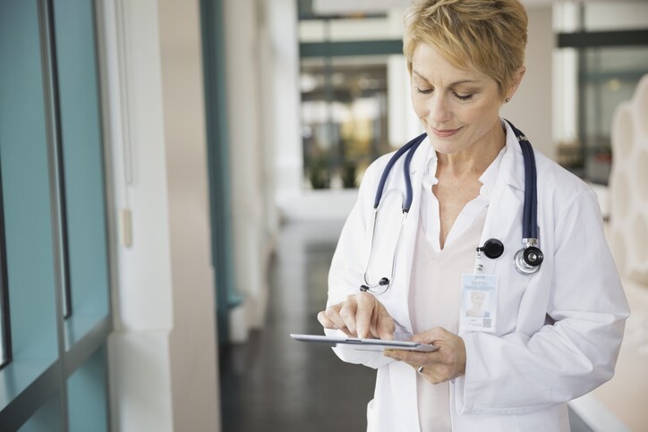 Female doctor using digital tablet in hospital
