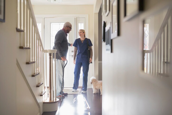 Nurse and patient talking in hallway