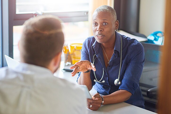 Doctor chatting to male patient