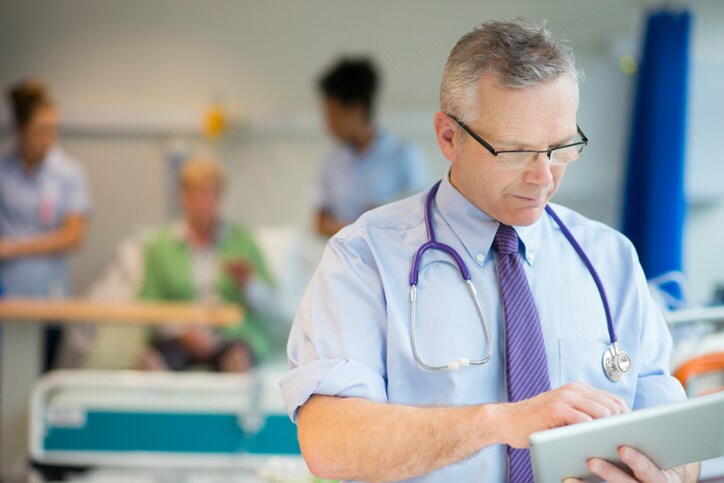doctor checking notes