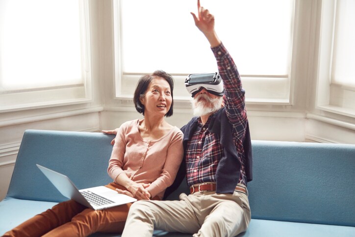 Senior couple using virtual reality headset