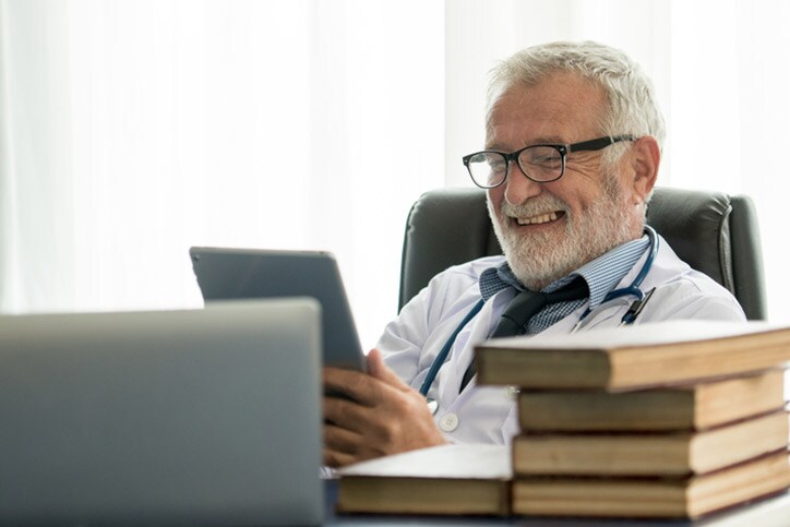 Happy doctor in office hospital