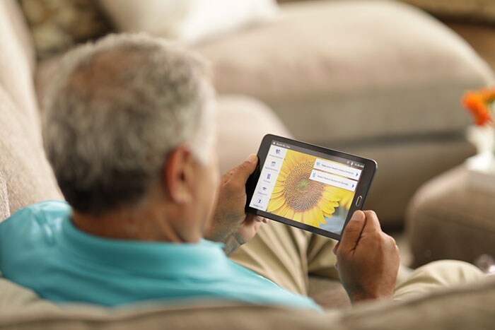 With the eCareCompanion app, patients can log their daily health status with a tablet at home.