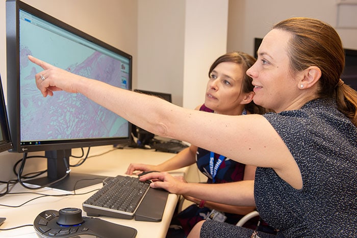 Download image (.jpg) Dr Lisa Browning and Professor Clare Verrill, Honorary Consultant in Cellular Pathology at Oxford University Hospitals working with Philips IntelliSite Pathology Solution?s Image Management System (opens in a new window)
