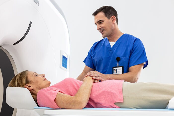 Download image (.jpg) The Philips Incisive CT with patient and technician. (opens in a new window)