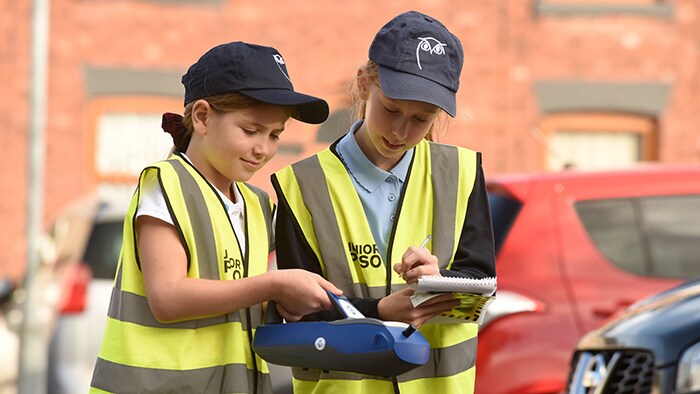 Children measuring air quality