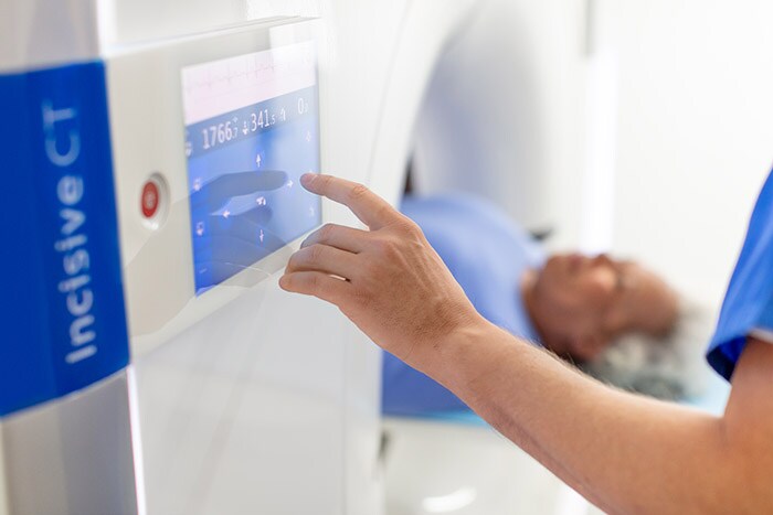 Download image (.jpg) Philips Incisive CT in use by tech operator (opens in a new window)