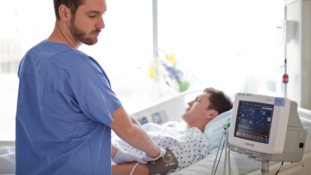 Download image (.jpg) (opens in a new window) Two doctors reviewing mammogram case