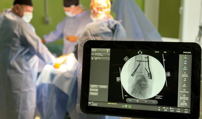 A patient receives minimally invasive treatment guided by a Philips C-arm system at National Rehabilitation Center Unbroken in Lviv, Ukraine.