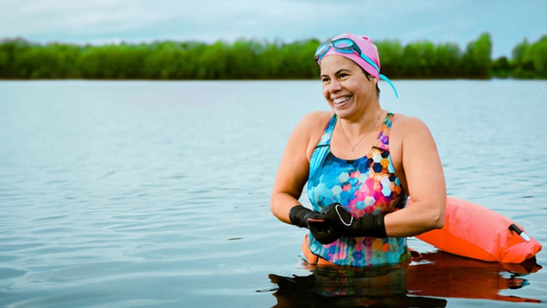 Woman swinging in lake