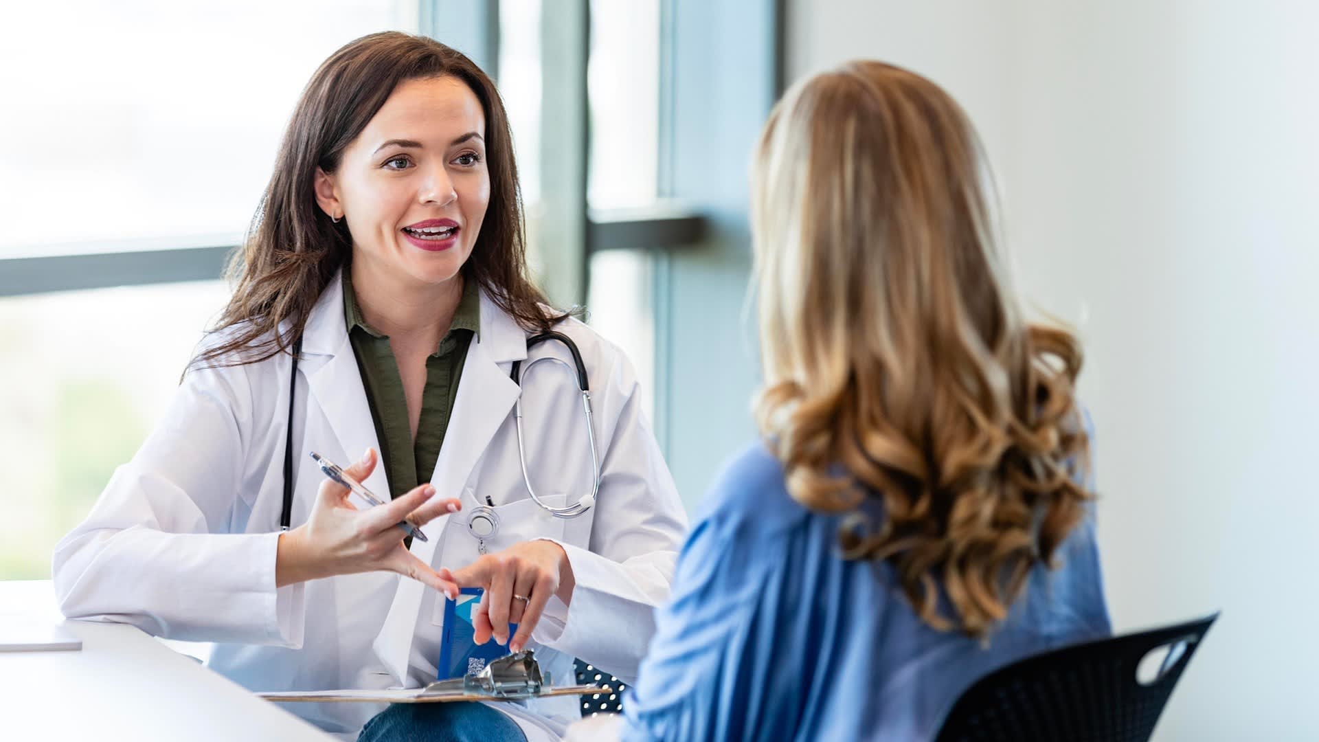 A physician having a conversation with a patient