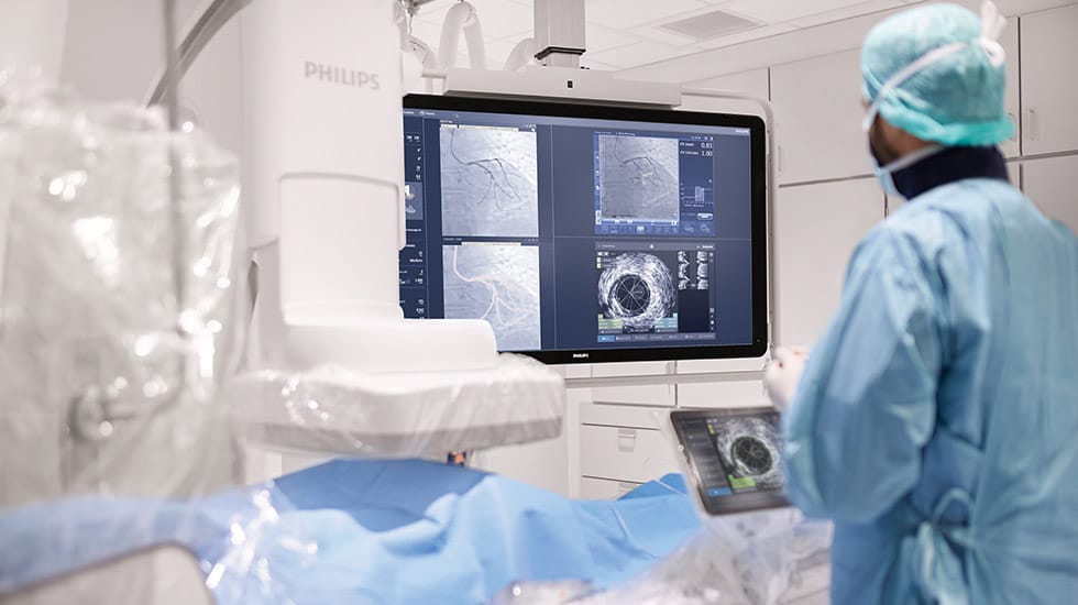 Clinician and patient with Azurion and IntraSight