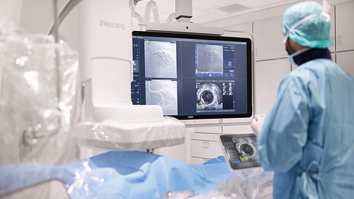 Clinician and patient with Azurion and IntraSight -  