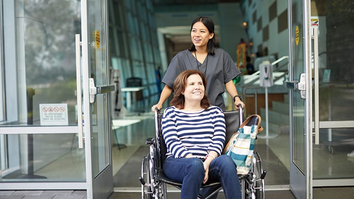 Female patient leaving hospital -  
