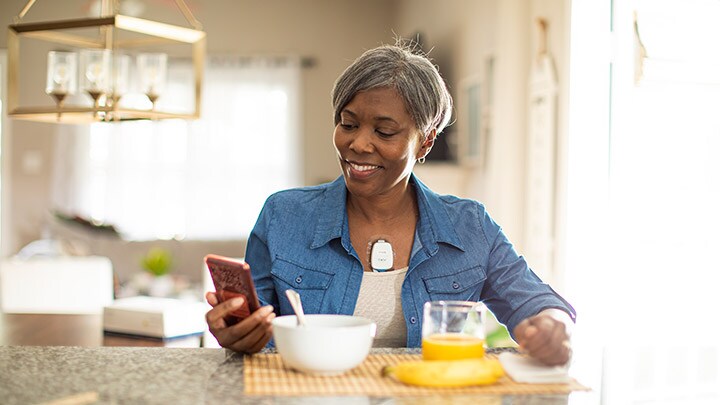 woman having breakfast whilst wearing epatch