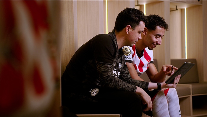 PSV player Salah-Eddine and sports scientist Ruud van Elk from PSV are studying the player data together. -  