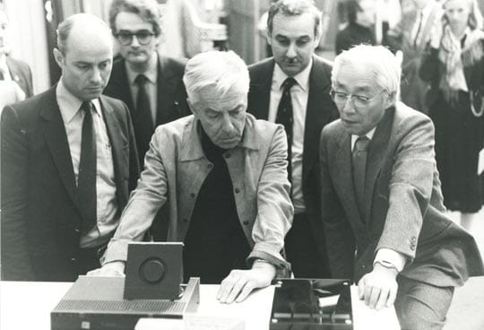Conductor Herbert von Karajan with Akiyo Morita, President of Sony, at his left and Joop Sinjou of Philips at his right.