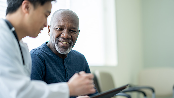 A healthcare professional and their patient in discussion -  